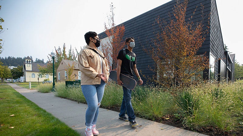 Students walking in front of the Lyllye Reynolds-Parker Black Cultural Center