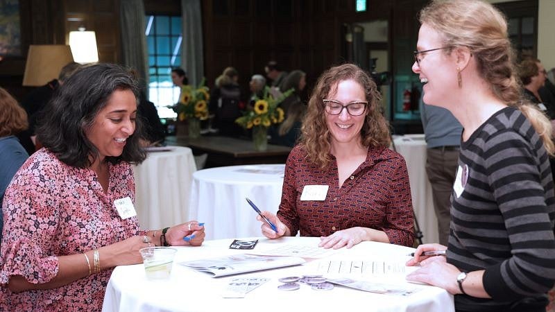New faculty members at a table