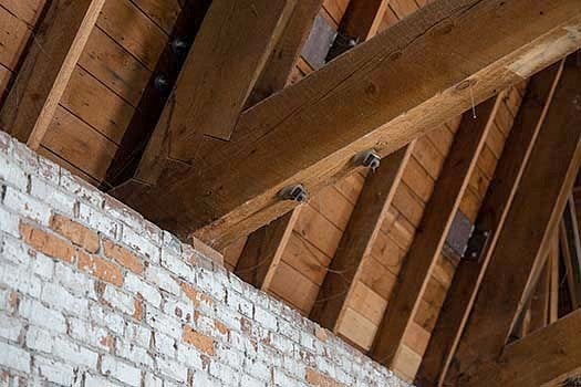 Hand-sawn joints connect some of the roof beams to walls