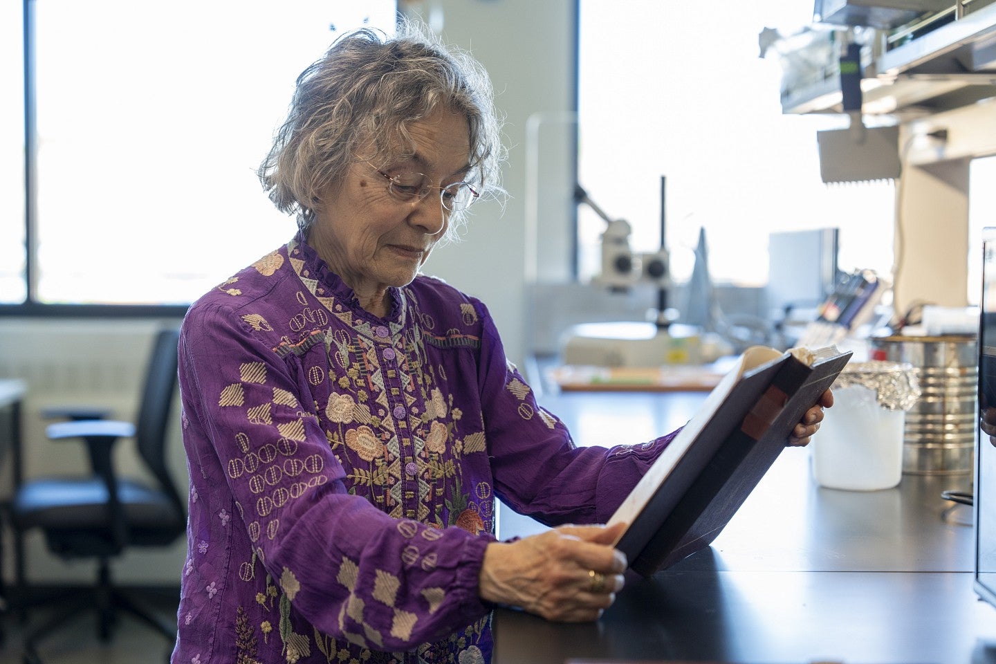 Judith Eisen examines her old lab notes