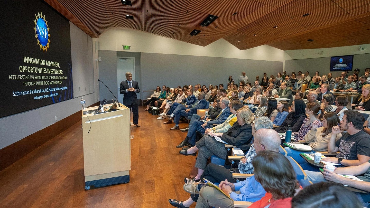 NSF Director Sethuraman Panchanathan gives a talk to a full classroom on the UO Eugene campus