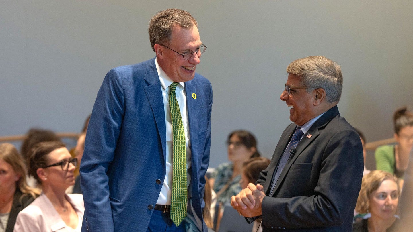 President Scholz laughs with NSF Director Sethuraman Panchanathan