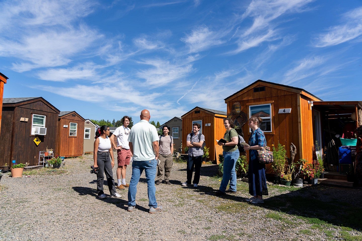 Students standing in the courtyard of the "Everyone's village" during the Bruton Design Intensive