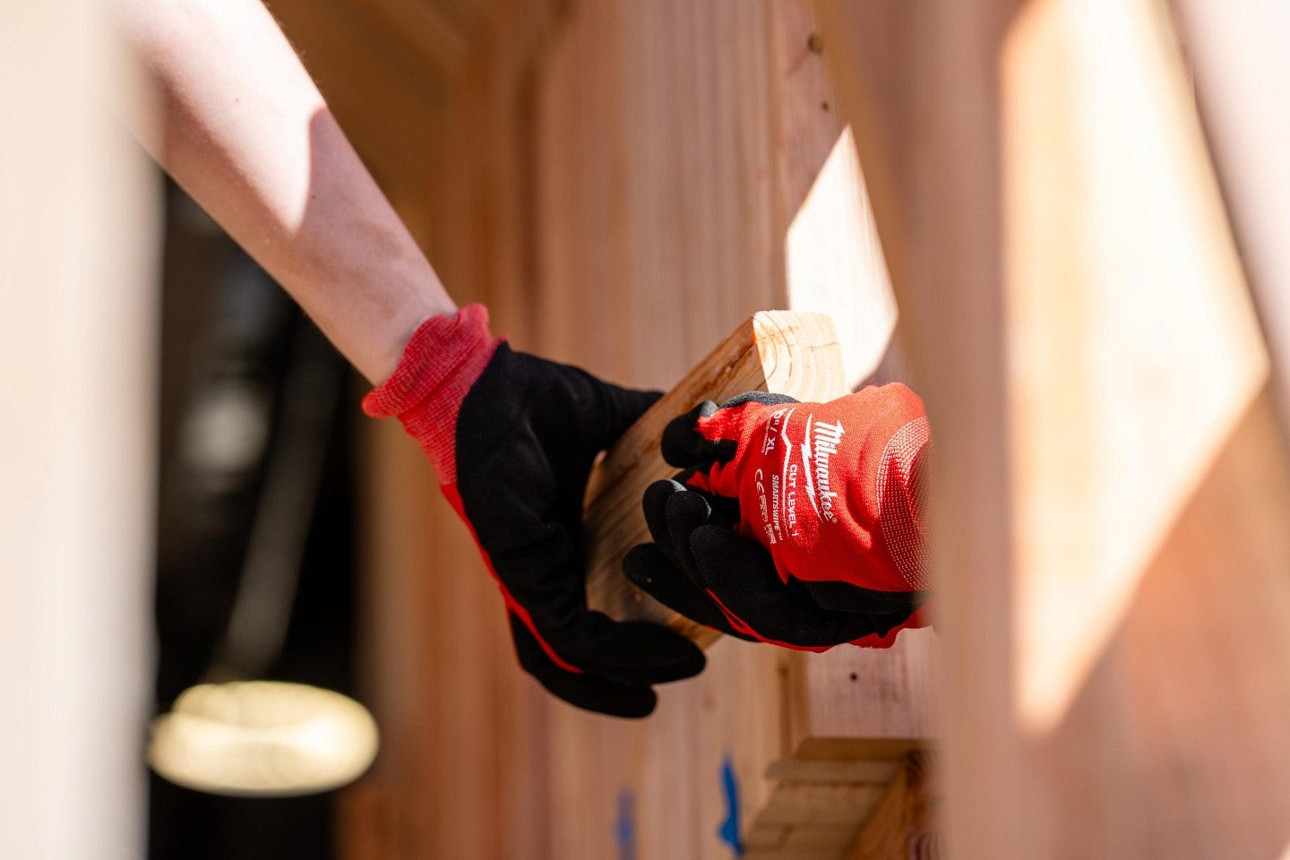 A student using a power hand drill