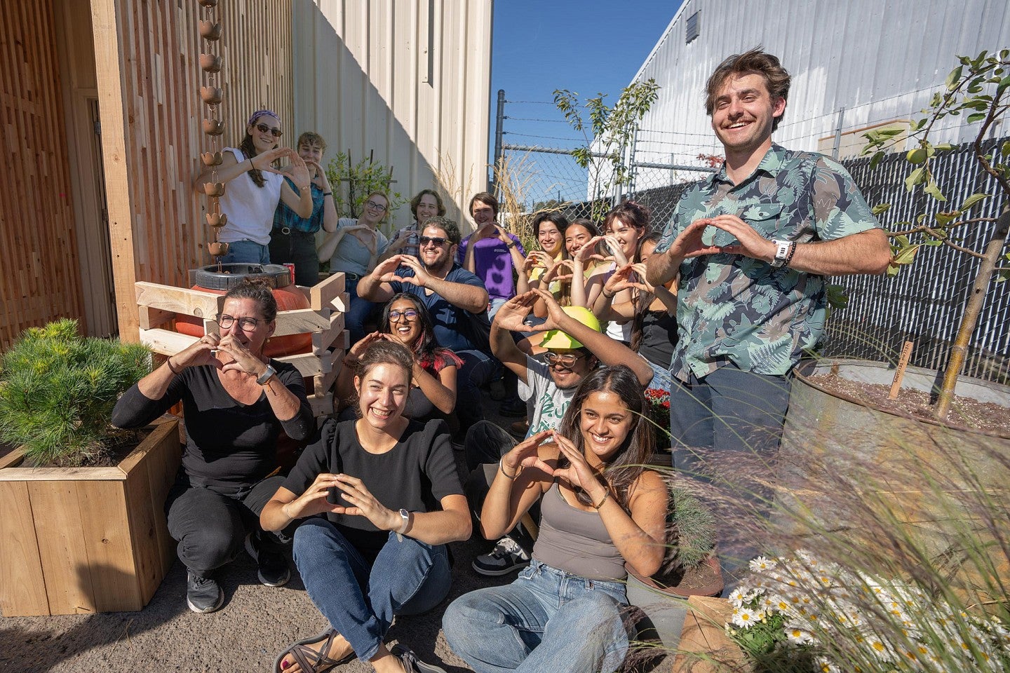 The 2024 Bruton Design Intensive group all "Throwing the 'O'"