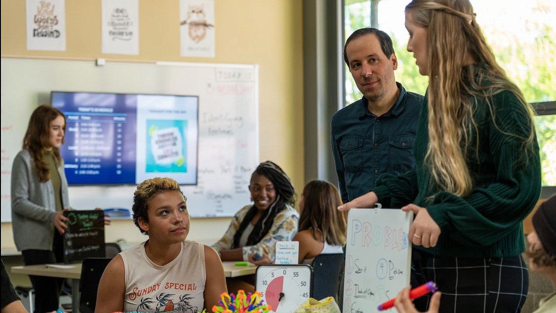 Ballmer Institute clinical faculty members and students, speaking with middle-school students