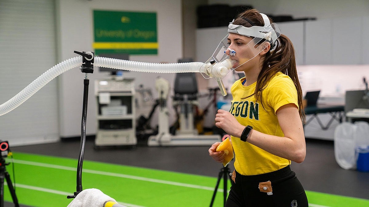 a student athlete participates in sport research by wearing scientific instruments while running