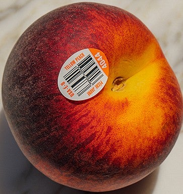A peach with a UPC bar code sticker