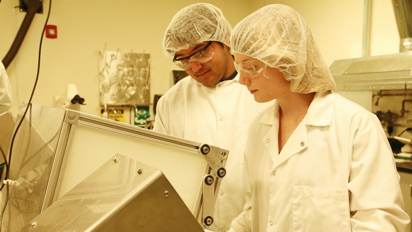 Students preparing the base material for semiconductors