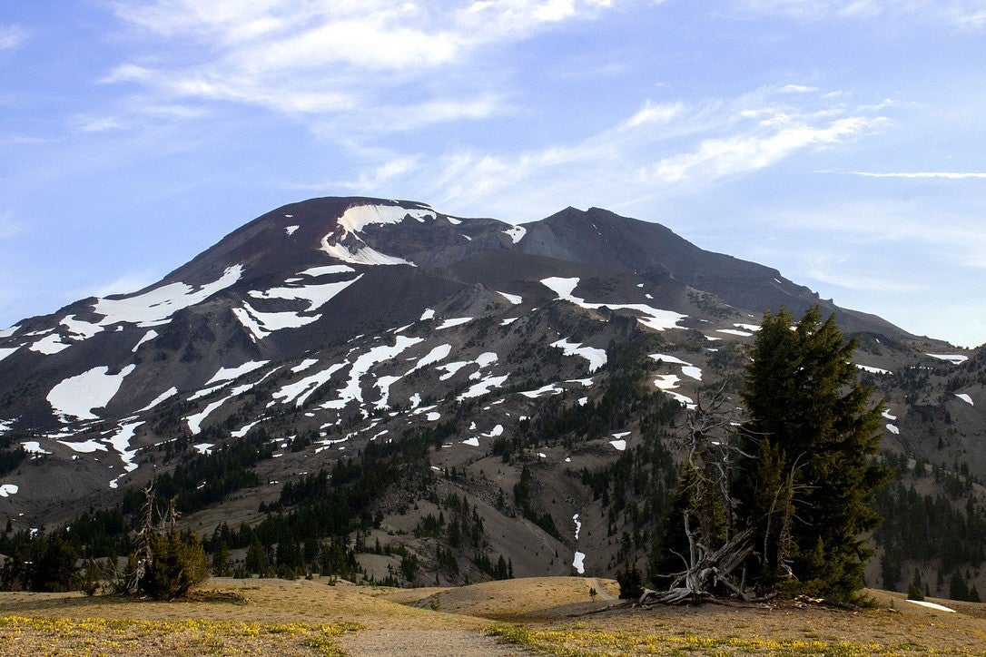 The South Sister volcanic peak covered in patches of snow.