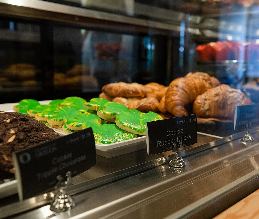 Green Duck cookies in a case at a campus eatery