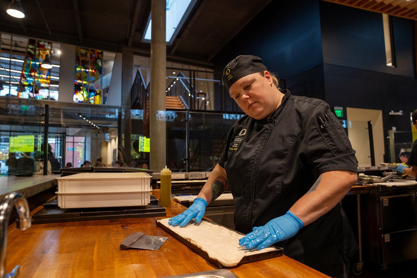 UO chef Terra Stock making pizza dough