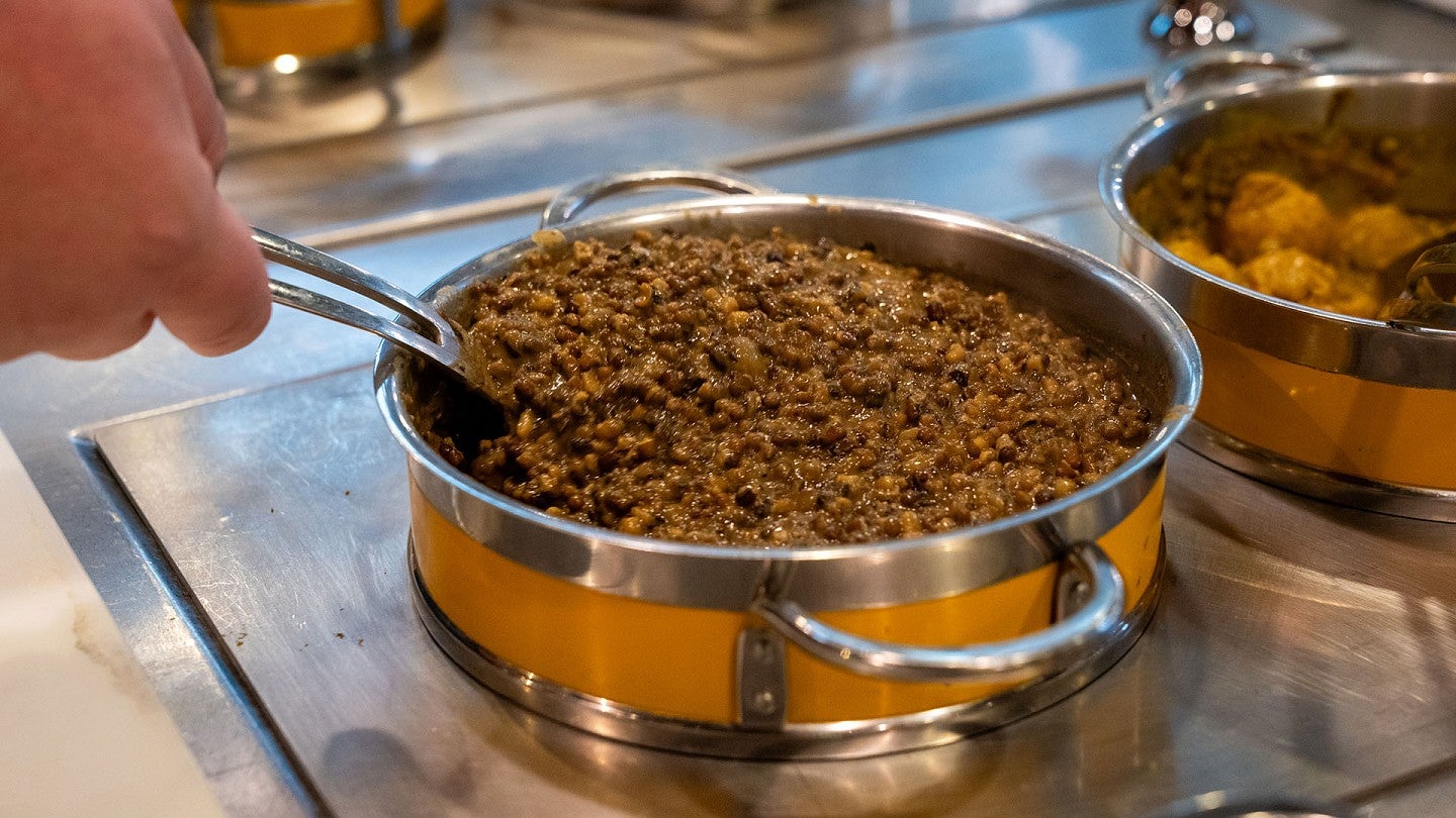 A pot of lentils being kept warm