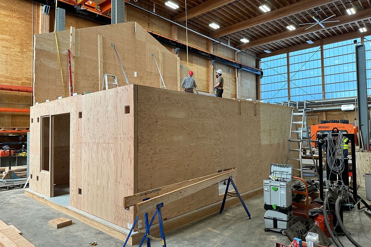 exterior of a mass plywood prototype house under construction