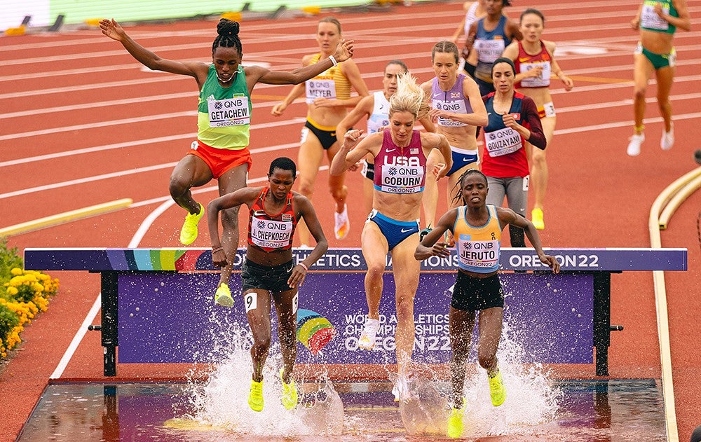 Athletes competing in the steeplechase event at Hayward Field