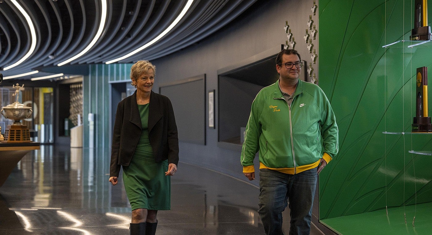 T. Bettina Cornwell and Yoav Dubinsky walk through Hayward Hall at the UO’s Hayward Field