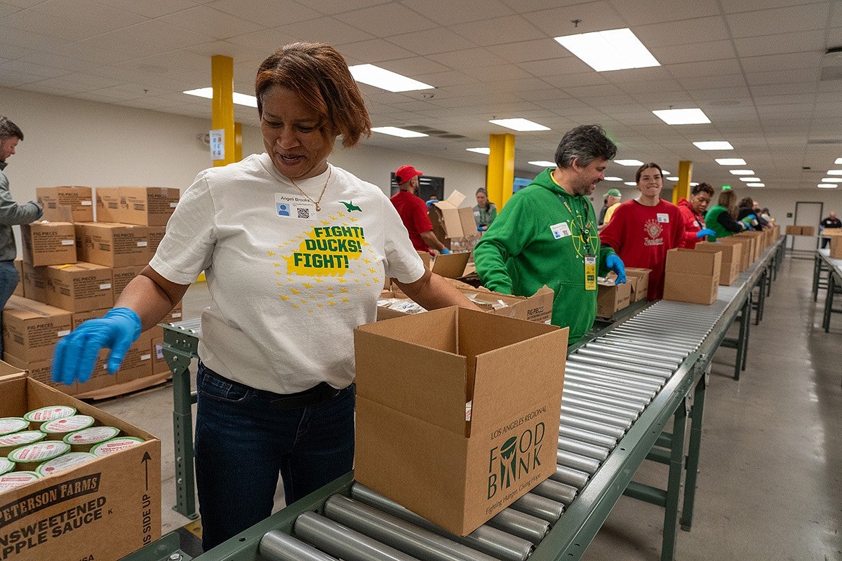 Volunteers packing food boxes at the LA Regional Food Bank. 