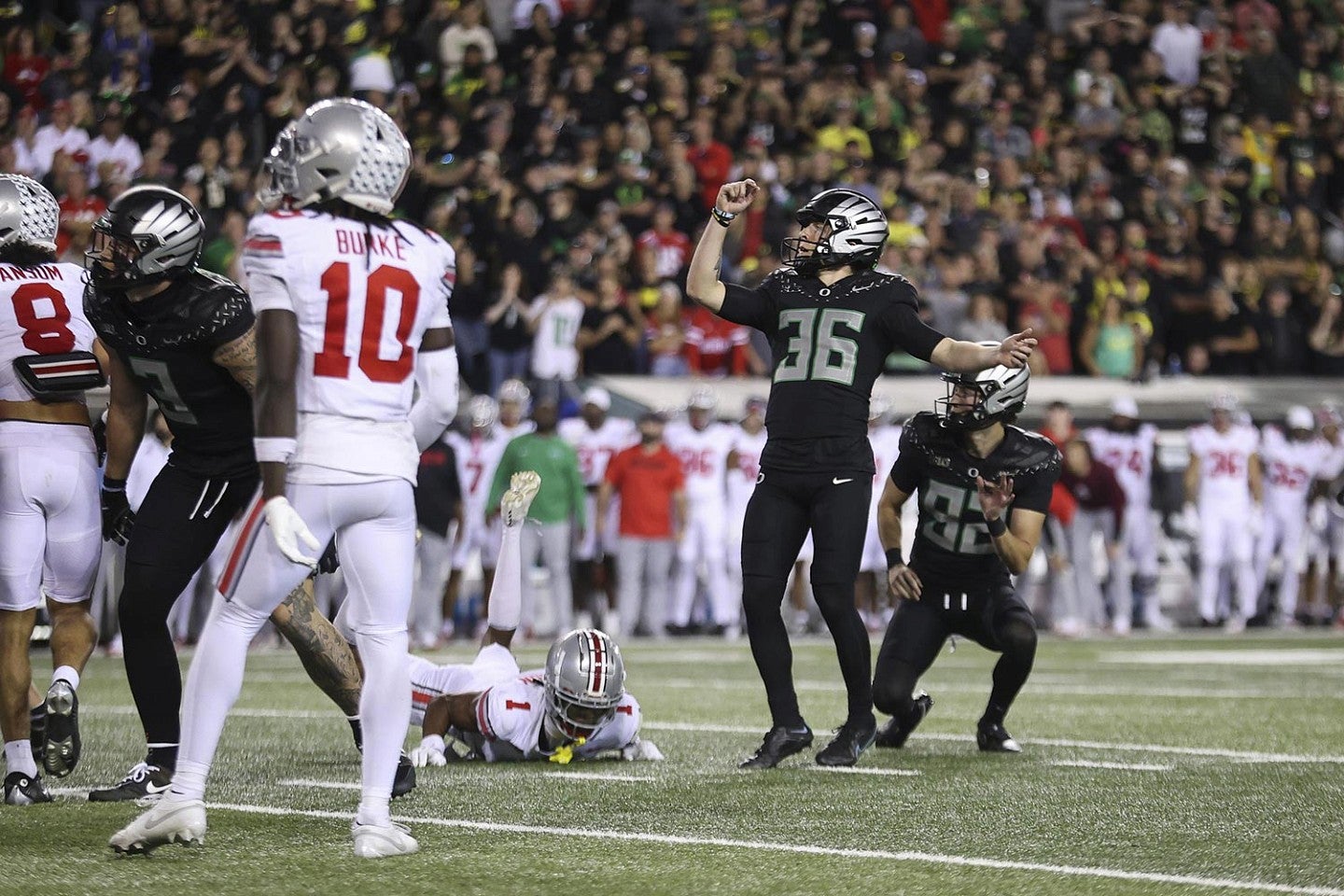 UO and OSU football players during a game