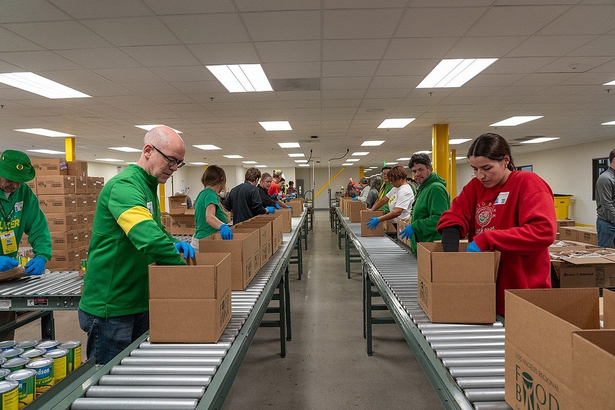 Volunteers packing food boxes at the LA Regional Food Bank.