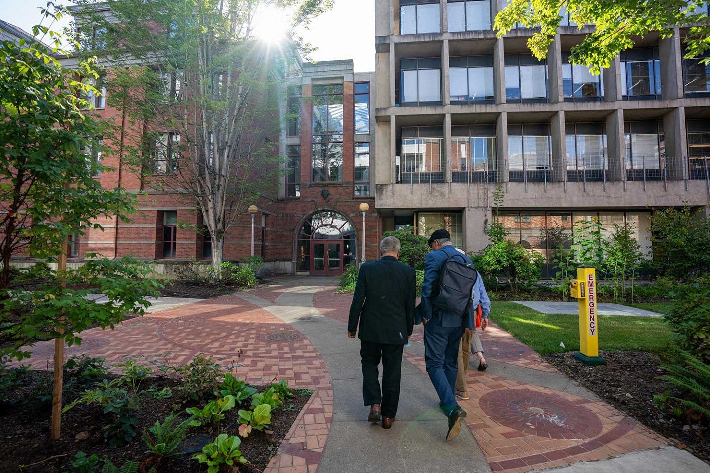 Director of the U.S. National Science Foundation walks with UO President Scholz during a visit to the Eugene campus