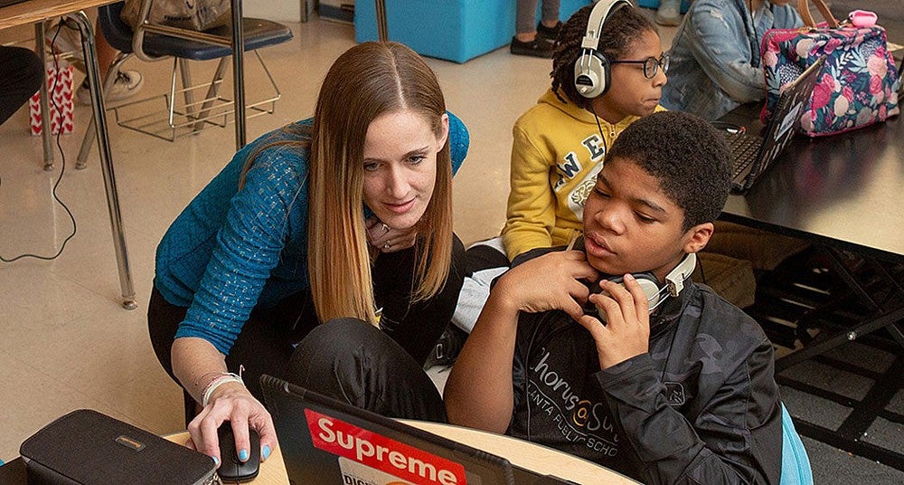 student and teacher in classroom
