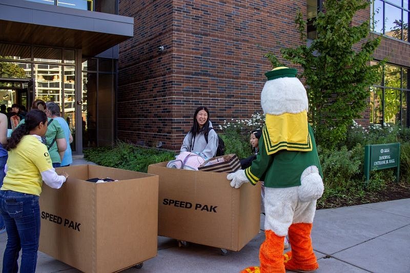 The Duck helps a student move into Unthank Hall