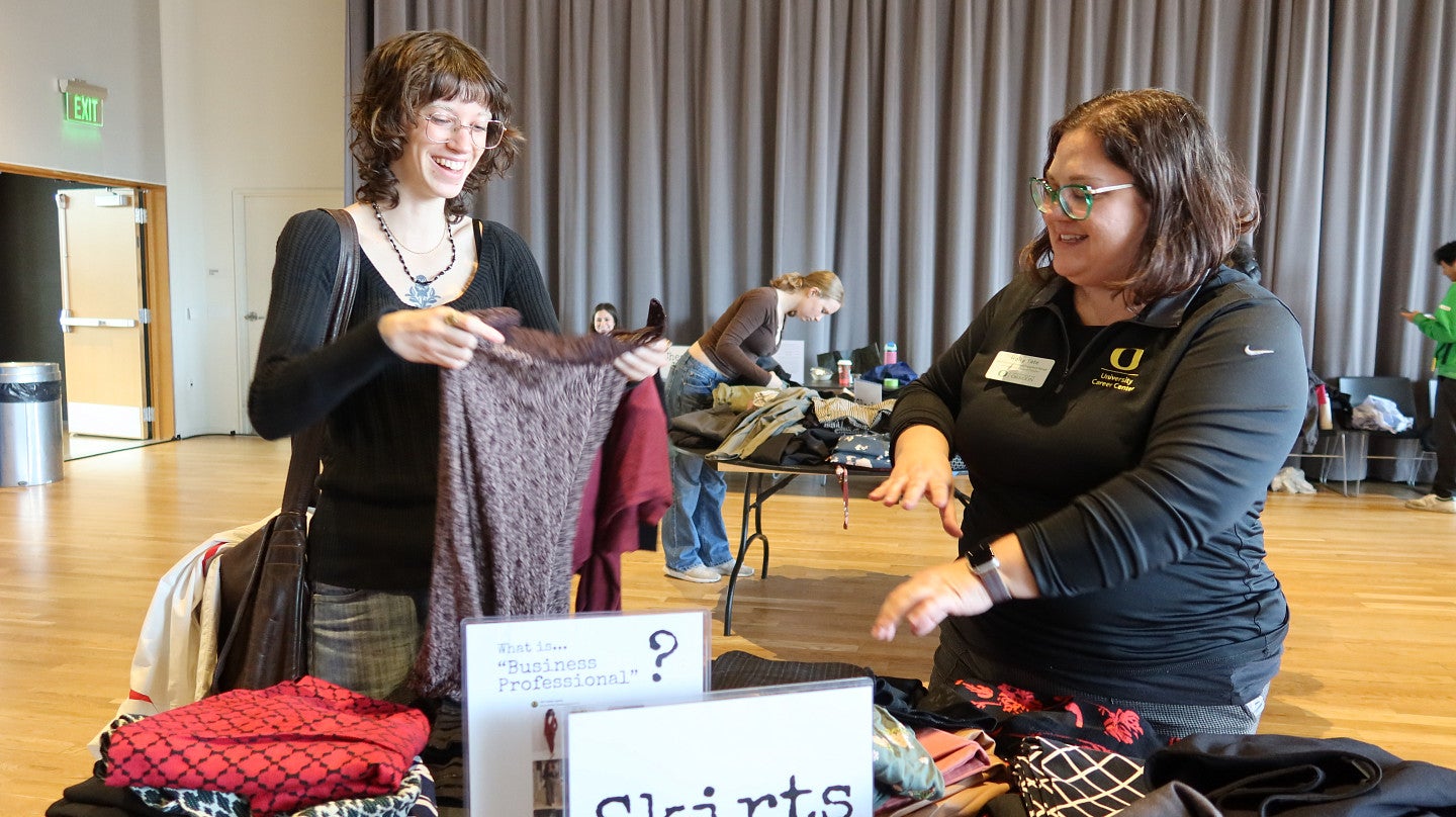 Holly Tate (right), of the University Career Center, said staff, faculty and alumni donated an “overwhelming” amount of business attire so students such as Audrey Bederka can shine in job interviews (photo: Matt Cooper, University Communications)