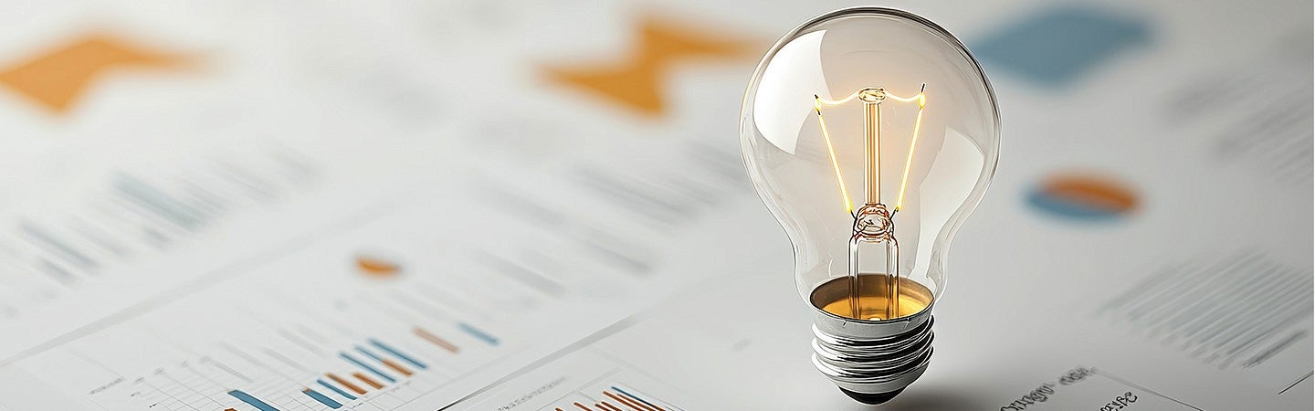 photo of lightbulb and graphs to represent entrepreneurship