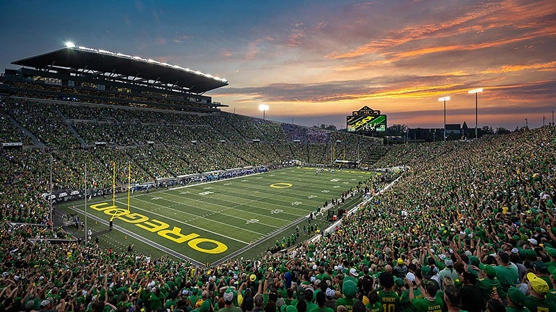 a crowd watching a football game at Autzen Stadium