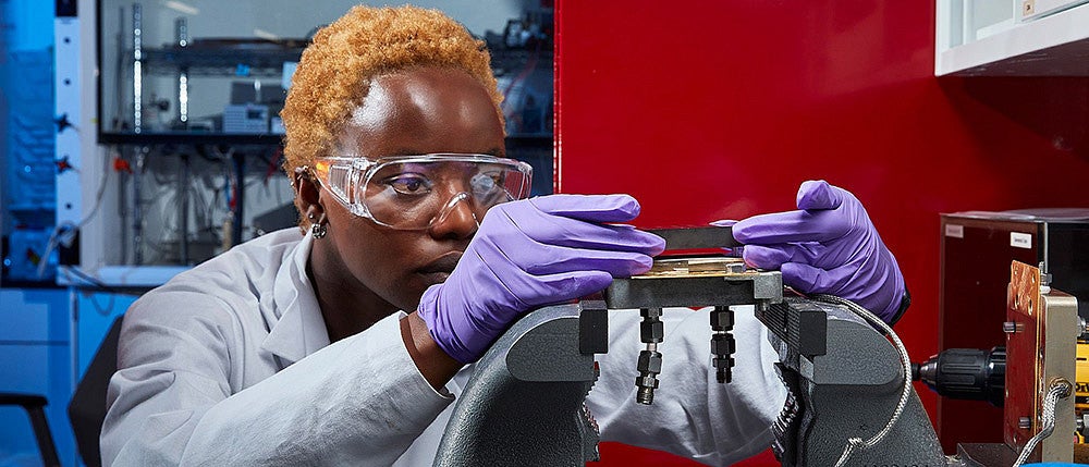 Michell Marufu working in a lab