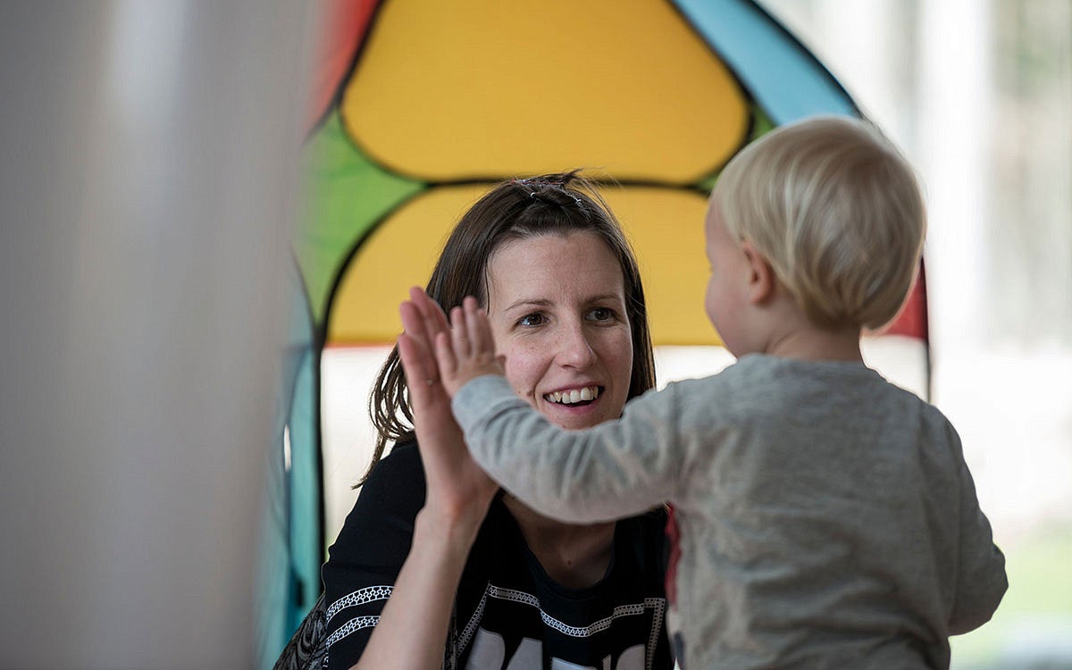 a person gives a child a high five