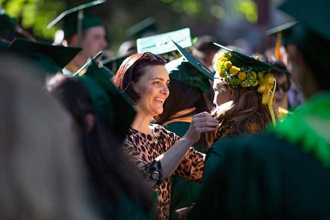 A family member congratulating a graduate A family member congratulating a graduate