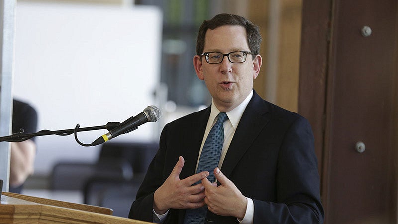 President Schill speaking at a podium