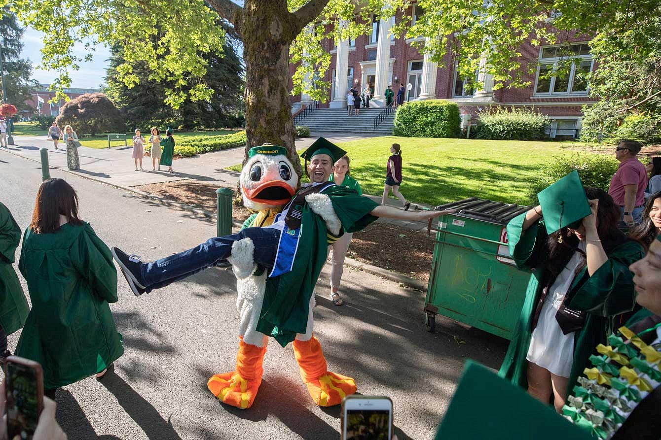 The Duck carrying a graduate in front of Johnson Hall The Duck carrying a graduate in front of Johnson Hall