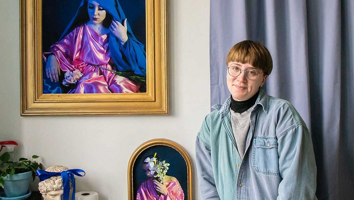 Allison Schukis standing in front of two photos