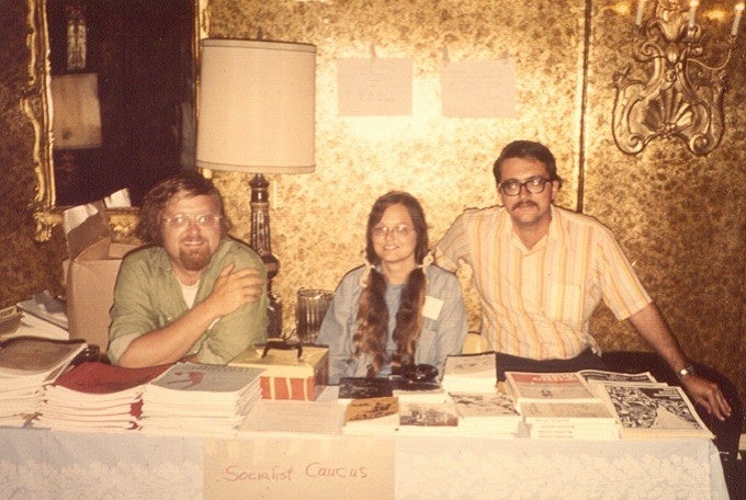 photo of two men and a woman tabling at an event