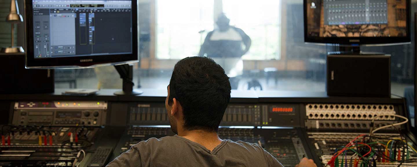 Student in a recording booth