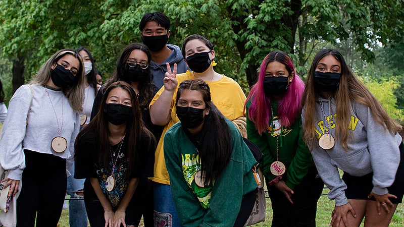 students pose for a group photo at the New Student Fall Retreat