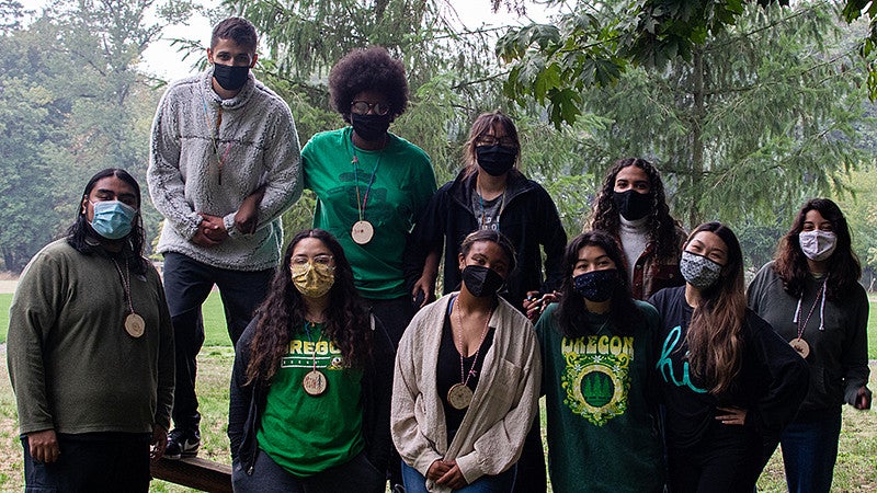 students pose for a group photo at the New Student Fall Retreat