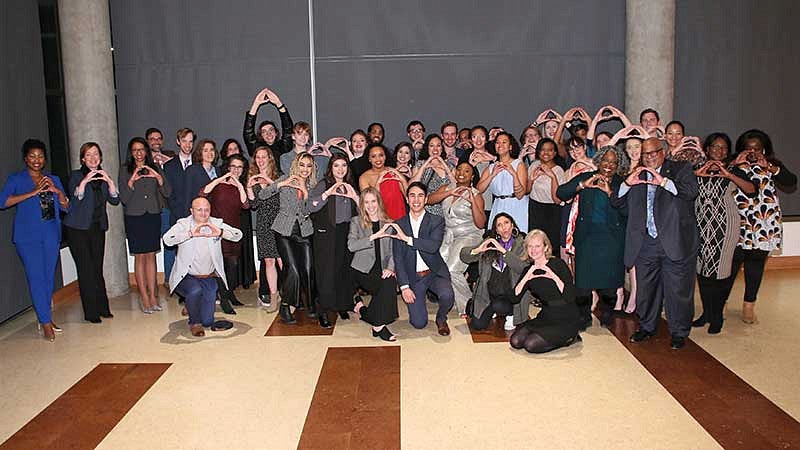 Black Law Students Association group photo with members throwing the O