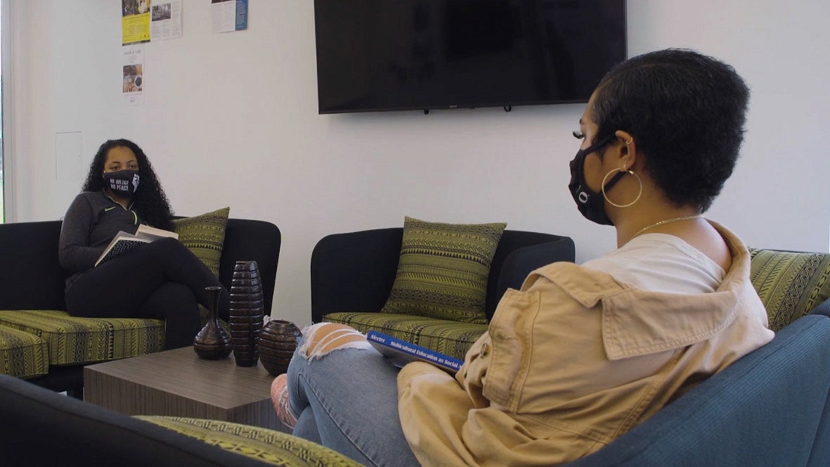 Two students in a lounge at the Black Cultural Center at the UO