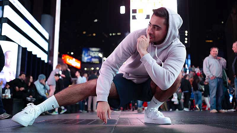 UO SOJC student Ammas Tanveer posing in Times Square