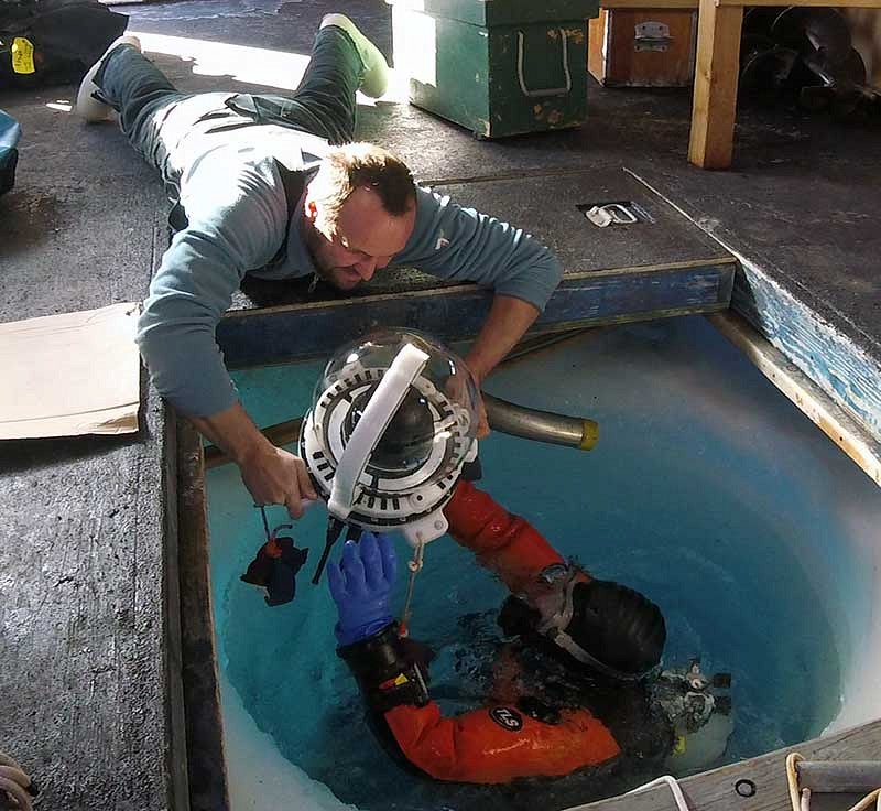 Loading the underwater camera into the water