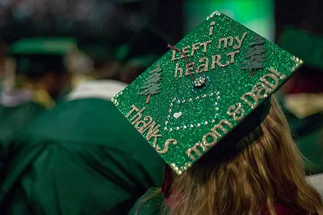 Graduation cap reads: I left my heart in Oregon. Thanks mom and dad. Graduation cap reads: I left my heart in Oregon. Thanks mom and dad.