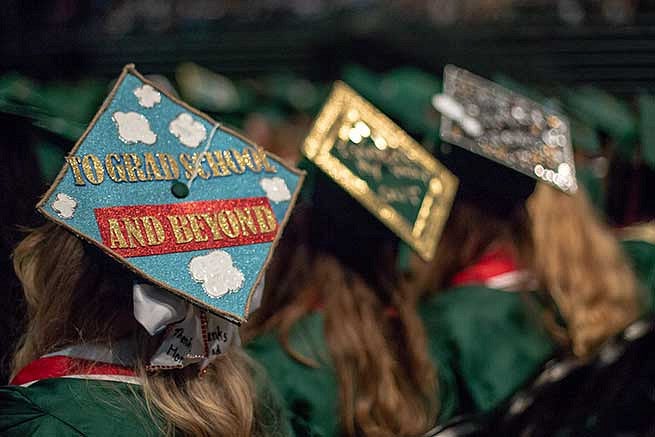Graduation cap reads: To grad school and beyond. Graduation cap reads: To grad school and beyond.