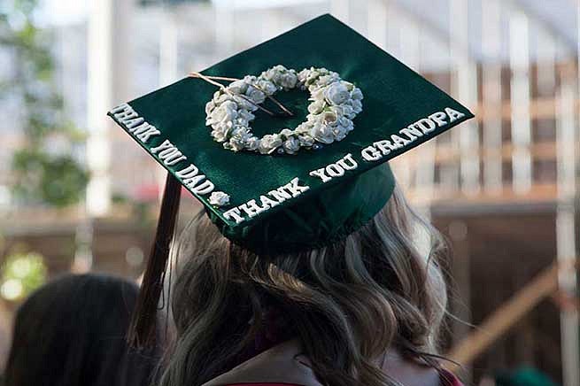 Graduation cap reads: Thank you dad. Thank you grandpa. Graduation cap reads: Thank you dad. Thank you grandpa.