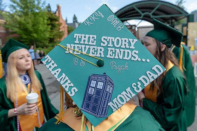 Graduation cap reads: The story never ends… thanks mom and dad. Graduation cap reads: The story never ends… thanks mom and dad.