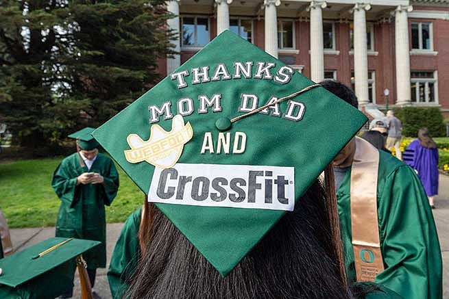 Graduation cap reads: Thanks mom and dad and CrossFit. Graduation cap reads: Thanks mom and dad and CrossFit.
