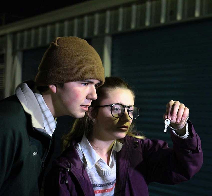 Two students looking at a key