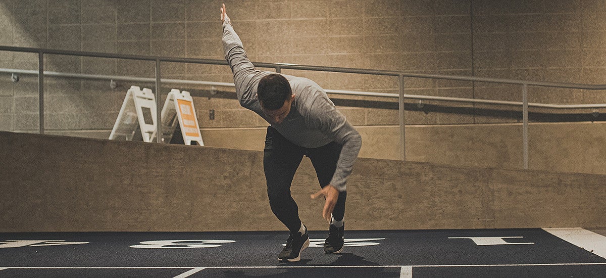 Devon Allen sprinting off a start line